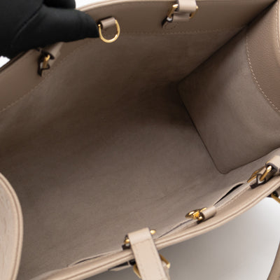 Onthego MM Dune Monogram Empreinte